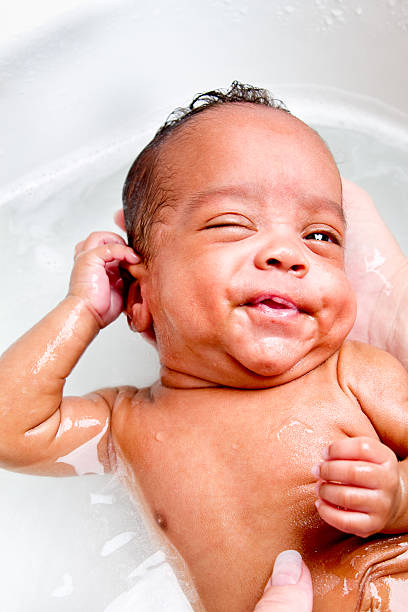 istock Cute Baby Boy Bathing in Kitchen Sink 182816646