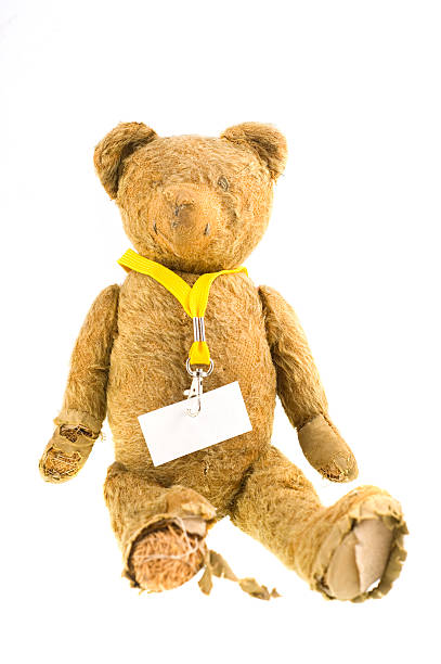 old teddybear with card 90 years old self-made teddy isolated on white with blank shield on keyholder entrence stock pictures, royalty-free photos & images