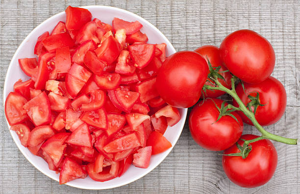 istock Vine Tomatoes on old wooden table 182816912