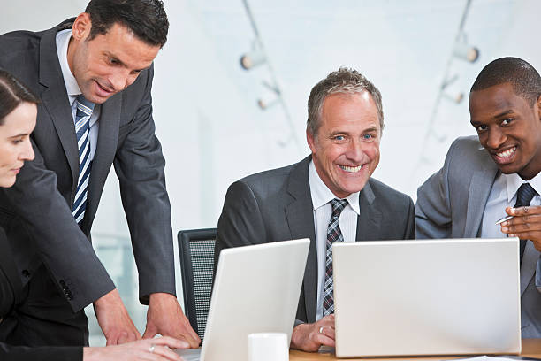 istock multiracial business team working on laptop 182816929