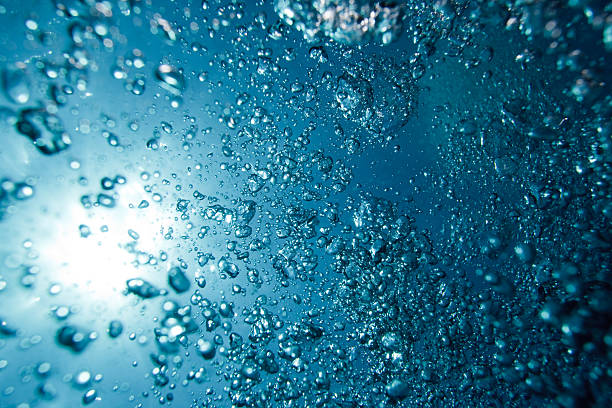 istock Hundreds of underwater air bubbles rising to water surface 182817155