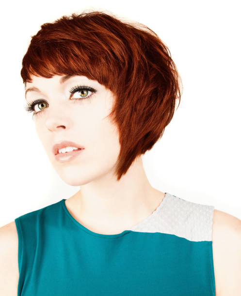 istock Attractive Young Woman Looks at Camera. White Background. 182817557