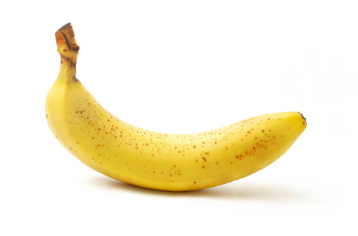 A very large photo of a ripe banana isolated on a white background (multiple images stitched).