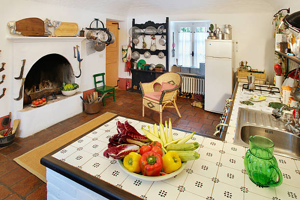 istock Kitchen in a rustic house, fireplace, many tools, terracotta floor 182818197