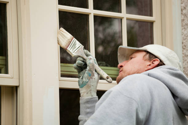 istock House Painter Working on Exterior Home Maintenance Improvement Painting Work 182819005