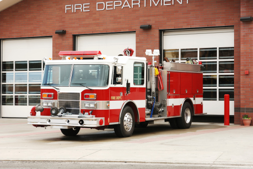 Belmont, NC, USA-November 23, 2022: Closeup of hose connection and control panel on the side of stationary fire engine