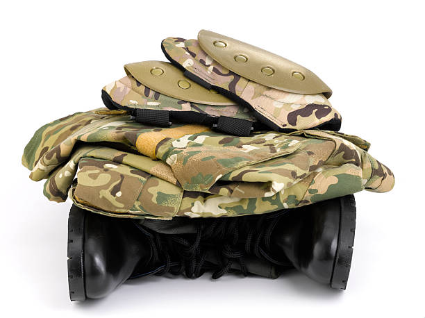 istock Camouflage uniform on top a pair army boots 182819387