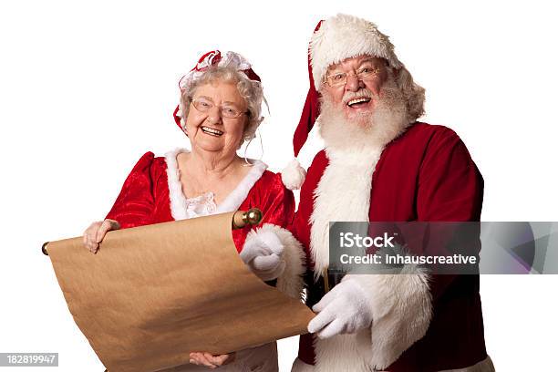 Photo libre de droit de Des Photos De Vrais Mme Noël Et Santa Qui Passe Audessus De La Liste banque d'images et plus d'images libres de droit de Mère Noël