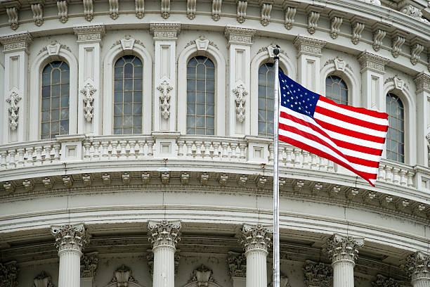 istock US Flag against Capitol Building 182819965