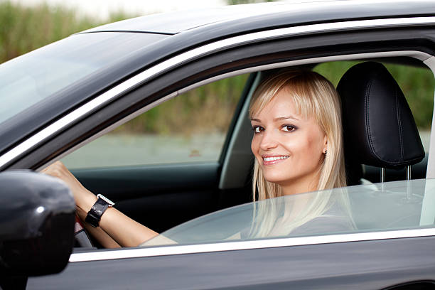 istock Woman driving luxury car 182820146