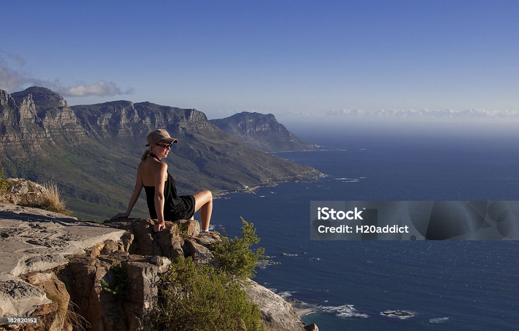 What a view Enjoying the view from the top. Feeling the pain and achievement of success and afternoon sun after a hard climb. Achievement Stock Photo