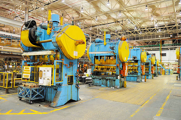 A arrangement of large tonnage presses in American manufacturing plant.  