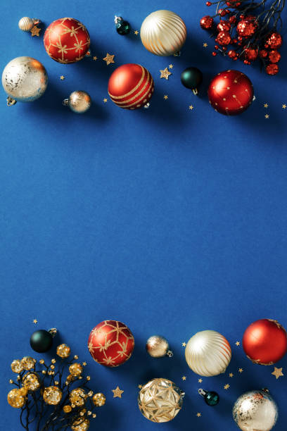 istock Blue Christmas background with red and gold balls. Flat lay, top view, copy space. 1828207453