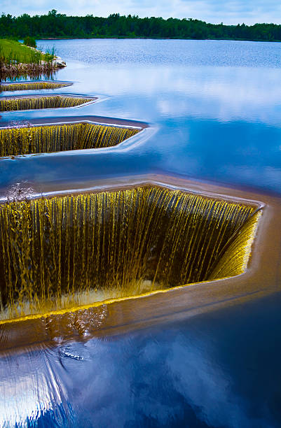 Surreal Lake Surface; Water Intakes Above Dam