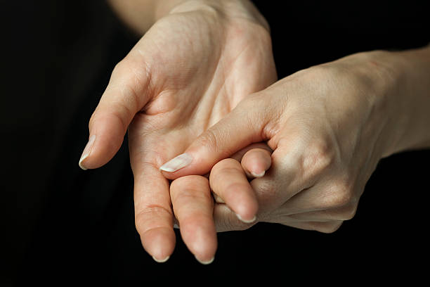 Arthritis pain in hands Female hands soothing their painful joints. You may also like: hand massage photos stock pictures, royalty-free photos & images