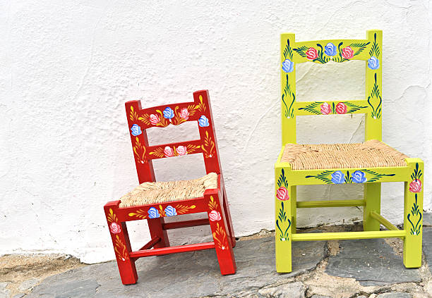 Two painted rustic chairs made in the Alentejo region of Portugal.