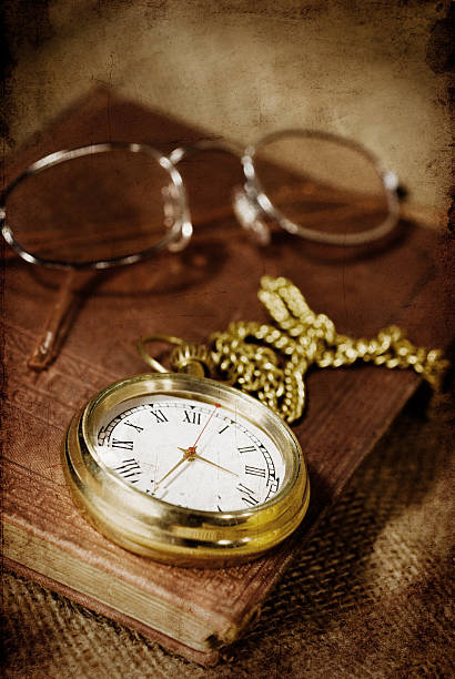 istock vintage book, watch and glasses 182821408