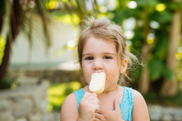 istock Girl licking ice cream in summertime 1828215220