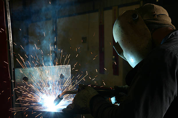 istock Welder Welding on Metal With Sparks Closeup 182822399