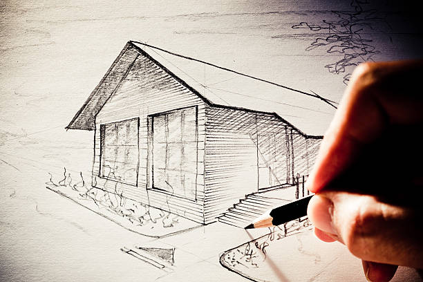 istock Hand sketching a little house 182822793