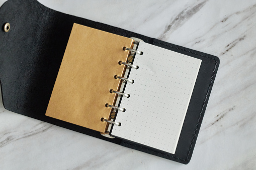 retro style loose-leaf notepad on table