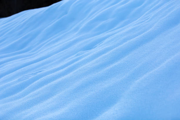 Blue and white snowdrifts texture.