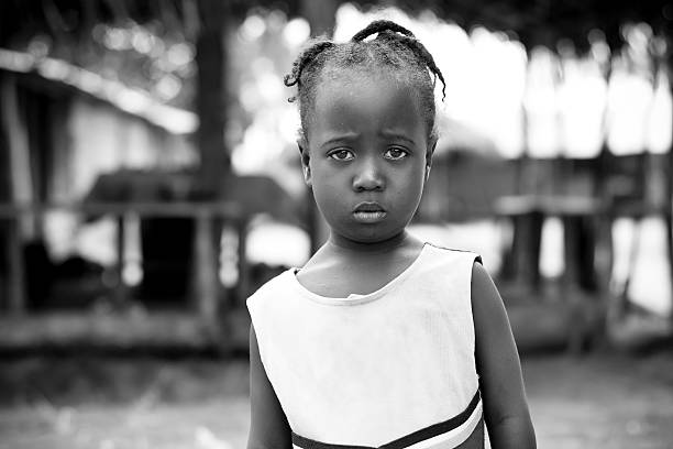 An African girl looking seriously at the camera.