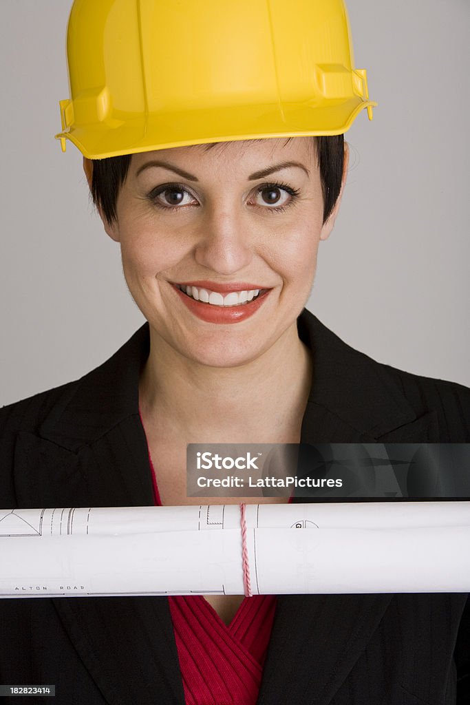 Portrait de sourire femme avec plan et hard hat - Photo de Adulte libre de droits