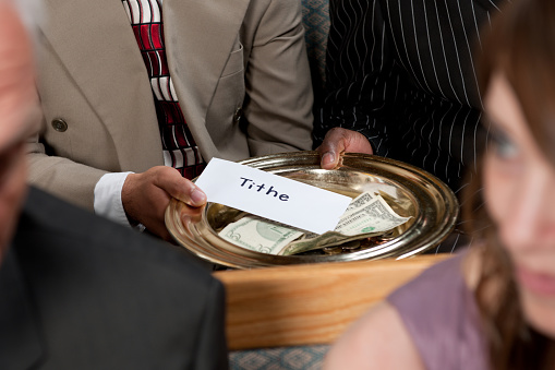 Tithes and offering during a church service. - Buy credits