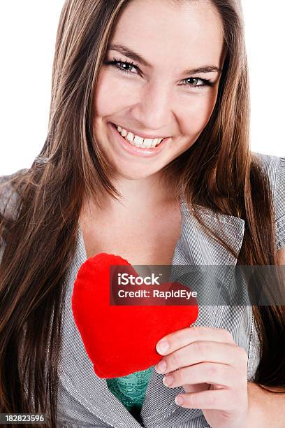 Attractive Woman Smilingly Offers You Plush Red Valentine Heart Stock Photo - Download Image Now