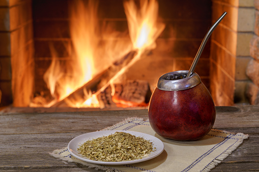 Cozy fireplace, winter holidays, calabasas - a traditional cup for mate, a drink of the peoples of South America. The cups were made by the Indians from a wooden gourd.