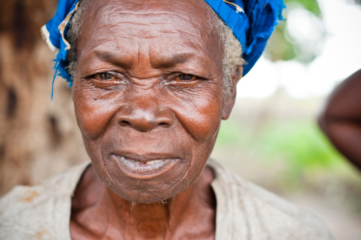 A portrait of an elderly African woman.