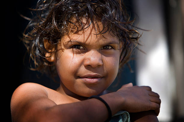 Aboriginal Child Serious expression on the face of a beautiful young Indigenous girl australian aborigine culture stock pictures, royalty-free photos & images