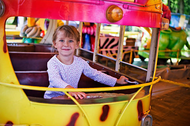 istock Little girl in amusement park 182824536