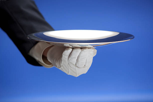 istock Butler Holding Empty Silver Tray on Blue XXL 182824660