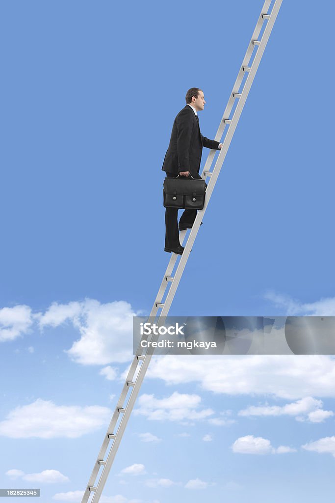 Ladder of Success Businessman climbing the ladder of success against a blue sky. Ladder Stock Photo