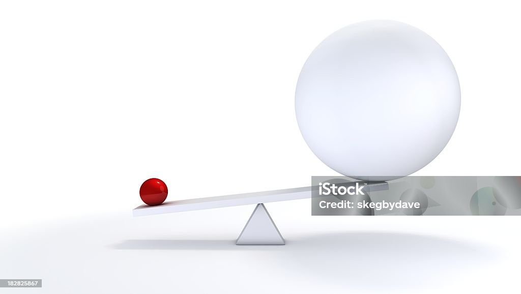 Small ball out balance. "A small concentrated ball has more weight than its bigger, less defined competitor.You may also like:" Large Stock Photo