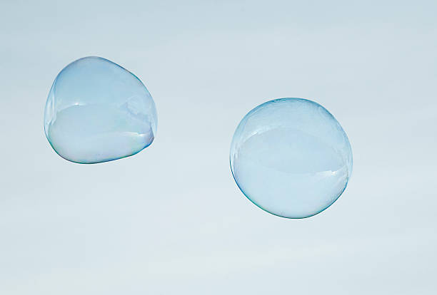 soap bubbles - soap sud bubble mid air circle стоковые фото и изображения