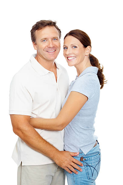 istock Mature couple hugging against white background 182826034