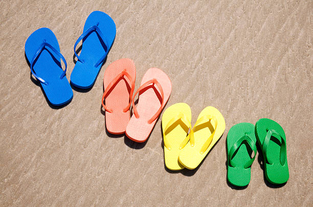 istock Row of Colorful Flip-Flops in Bright Summer Sun 182826109
