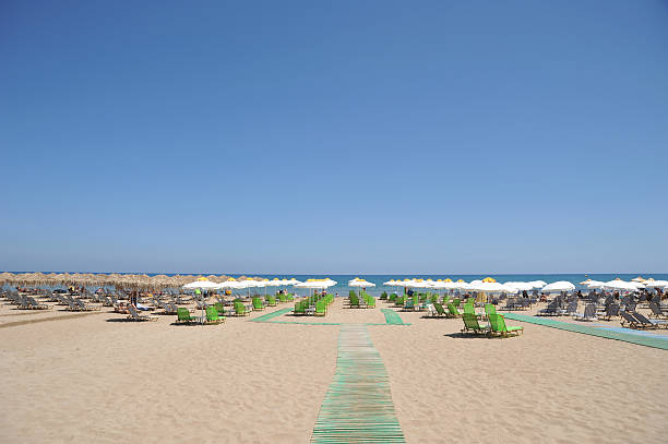 Chairs under a parasol on a beach