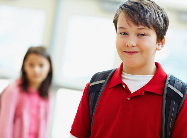 istock Cute school boy with friend in a background 182826346