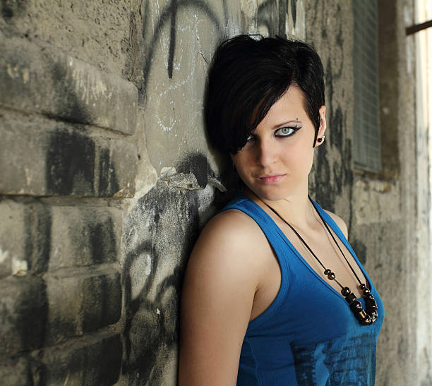 istock Young girl leaning on urban wall. 182826427