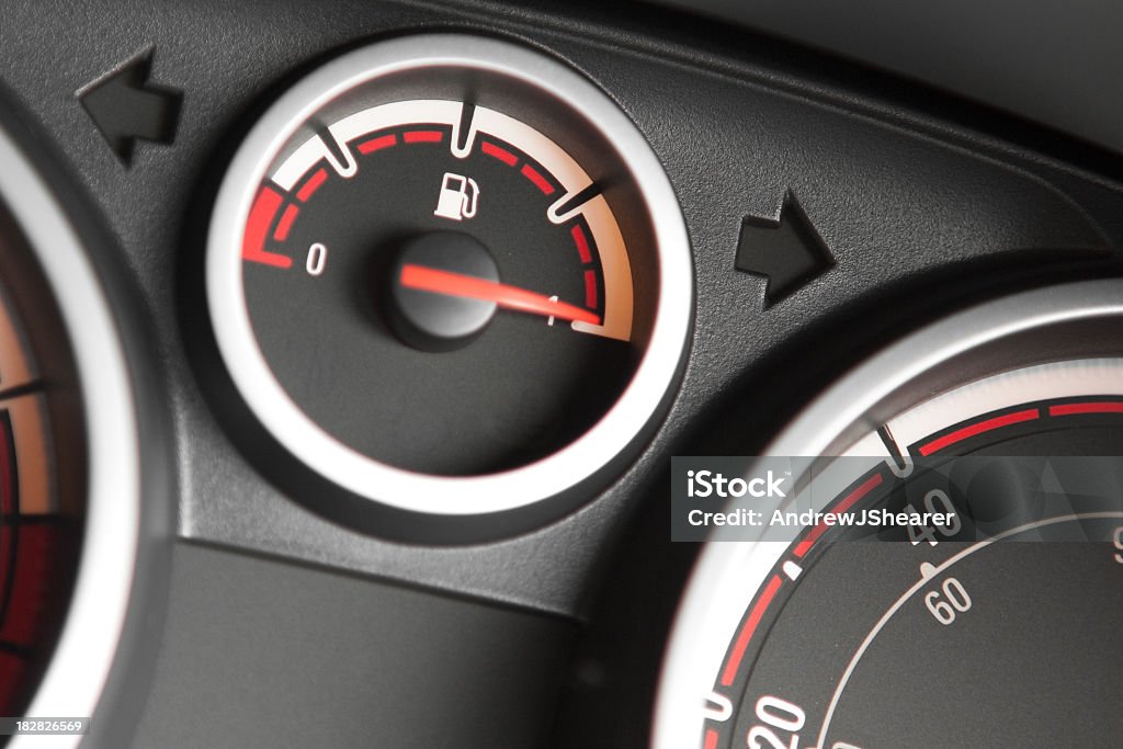 Close-up of the fuel gauge on a filled up car A fuel gauge in a vehicle displaying a full tank. Fuel Gauge Stock Photo