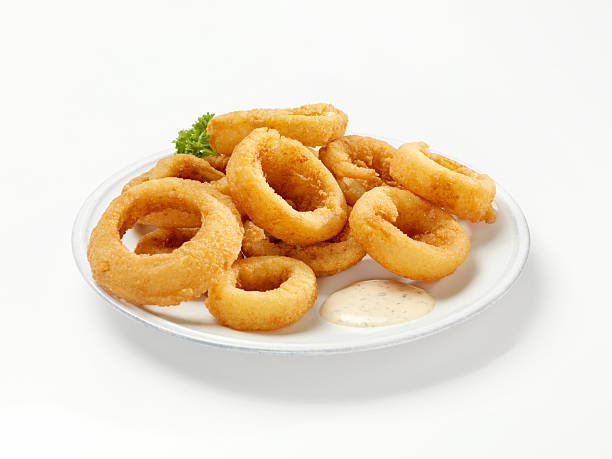 Thick Cut Onion Rings with Dip Thick Cut Onion Rings with Dip-Photographed on Hasselblad H3D2-39mb Camera deep fried photos stock pictures, royalty-free photos & images