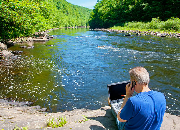 Telecommuting By The River stock photo