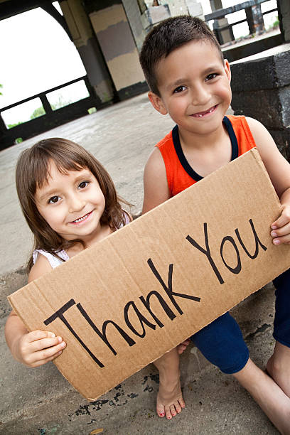 istock Thank You Sign Held By Cute Hispanic Children 182826933