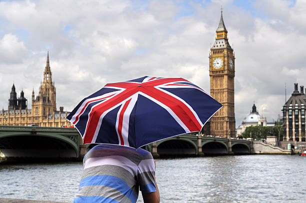 istock Big Ben and British flag umbrella 182827080