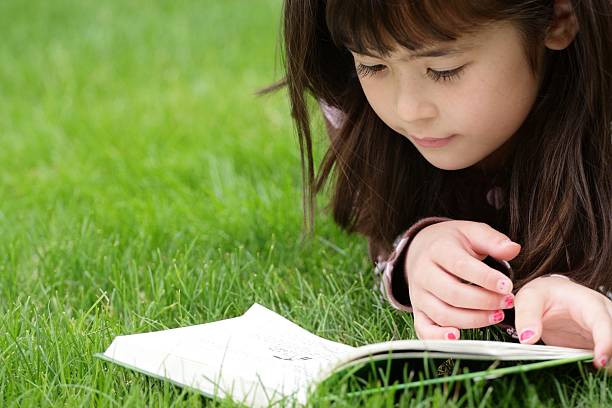 little girl read a fables book.see more...[url=http://www.istockphoto.com/file_search.php?action=file&lightboxID=5947506][img]https://dl.dropbox.com/s/lcysgflr59wpncj/Cop.Flavia.jpg?dl=1[/img][/url]