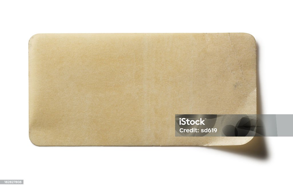 Old Label "Antique, old label isolated on white with soft shadow. Blank, with copy space. Clipping path included." Label Stock Photo